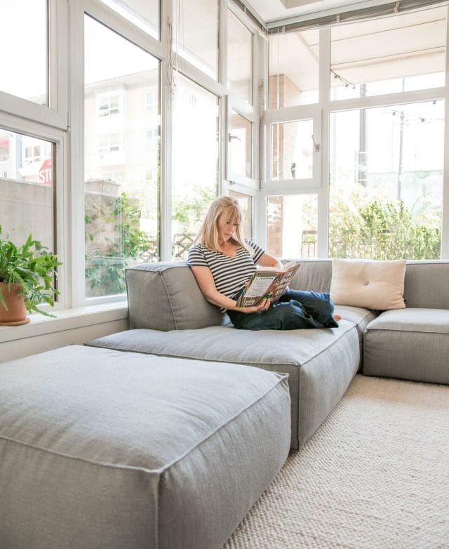 Alison Mazurek relaxes in her small apartment 