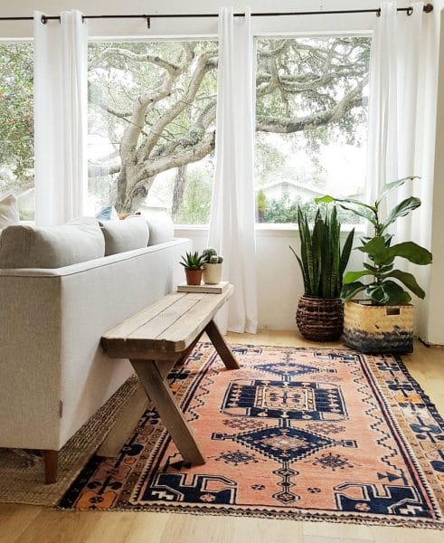 We love how the family over at Kismet house has separated their entrance from their sitting room with two rugs and some clever furniture blocking. The clean-lined Burrard makes a great canvas for the rustic bench.