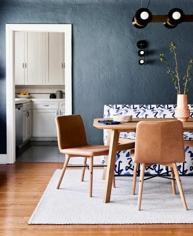 Dining room designed by Emily Henderson featuring the leather Kissa dining chair.