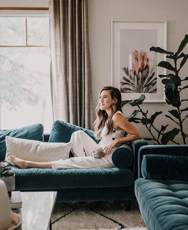 Photographer Monique Pantel captures a friend relaxing on her velvet Article sofas.